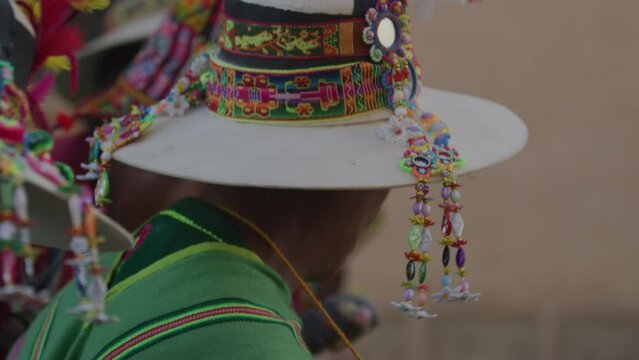 Close up of traditional apparel and bowler hats in rural village in Bolivia on men walking through street