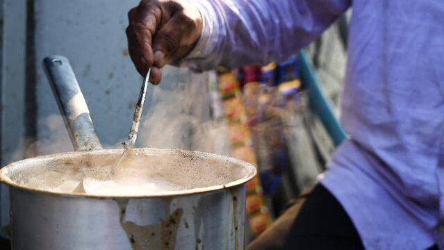 Tea being prepared by a teastall vendor in Delhi Street,India