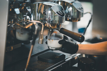 Barista cafe making coffee preparation service concept in restaurant. Close up hand barista making...