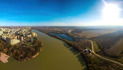 Brzegokai lake near the Kuban river surrounded by country houses - aerial drone panorama on a sunny winter day - obrazy, fototapety, plakaty