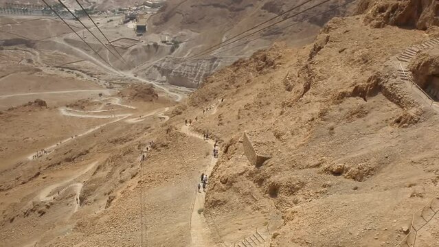 Line of tourists going down from Masada fortress
Masada Fortress near the Dead Sea, Israel, 2022, National Park
