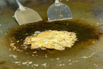 a lot of shrimp fried on tray