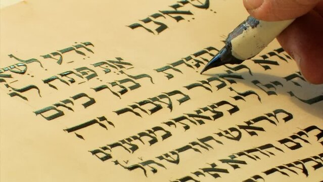 Sofer writes a Hebrew Passover Hagada, Close up
a Jewish text that sets forth the order of the Passover Seder, Israel, 2022 
