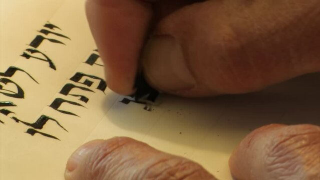 Sofer writes a Hebrew Passover Hagada, Close up, Israel
a Jewish text that sets forth the order of the Passover Seder, Israel, 2022 
