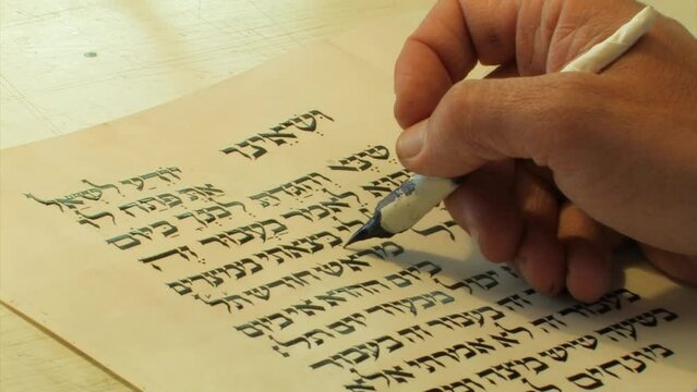 Jewish Sofer writes a Hebrew Passover Haggadah, Close up, 2022
a Jewish text that sets forth the order of the Passover Seder, Israel, 2022 

