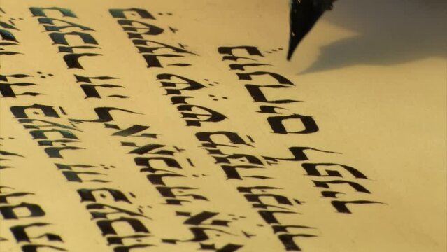 Jewish Male Sofer writes a Hebrew Passover Haggadah, macro view
a Jewish text that sets forth the order of the Passover Seder, Israel, 2022 
