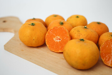 Fresh Orange Fruits Served on Wooden Board 