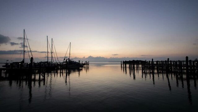 4k time lapse at sunrise over the marina in Alice Town, North Bimini, Bahamas