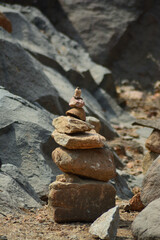 Stones are balanced on top of each other. Symbol of equilibrium and Zen