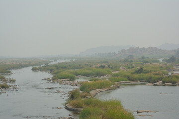 Landscape view of Hampi, a riot of colors, and rocky landscape.Ruins of Vijayanagara Empire. A UNESCO World hertiage site. Image of Rocky landscape.