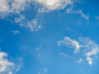Light soft clouds against a bright blue sky