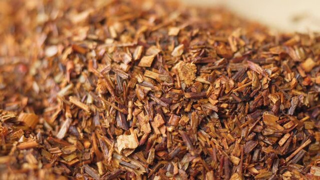 Rooibos or redbush tea leaves. Selective focus. Rooibos, a traditional drink in South Africa. Organic Tea