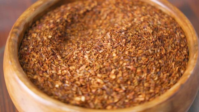 Rooibos or redbush tea leaves. Selective focus. Rooibos, a traditional drink in South Africa. Organic Tea