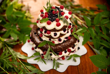 summer sponge cake with cream and fresh berries. Selective focus. square image
