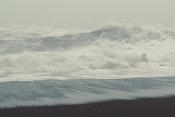 Foamy wave rolling on sand landscape photo. Beautiful nature scenery photography with mist on background. Idyllic scene. High quality picture for wallpaper, travel blog, magazine, article