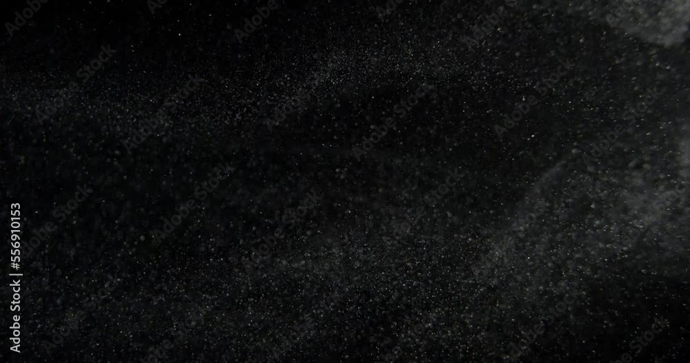 Sticker real dust particles on black screen overlay. filmed with red camera in slow motion. abstract shapes 