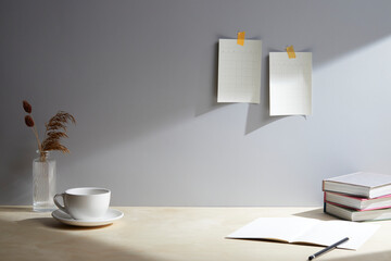 light wooden desk at morning with window light. copy space