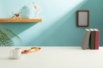 front view of pastel color desk table with offie supplies and cyan background. copy space