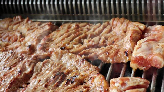 Grill pork ribs marinated in soy sauce. Bulgogi, the most popular pork dish in Korea.
