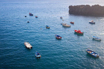 Colorful fisher boats in Camara de Lobos town, Madeira island, Portugal.