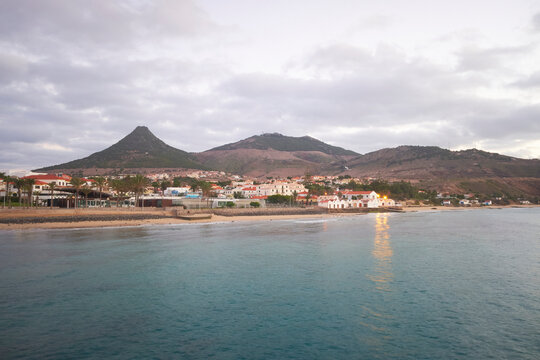Porto Santo island, view to its highest mountain Pico do Facho and capital city Vila Baleira. Beautiful early morning, sea and beach.