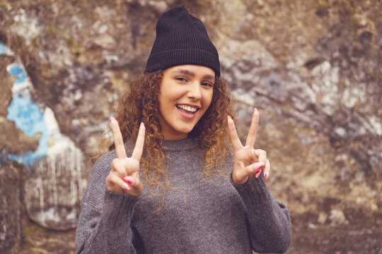 Hipster girl with knit hat - concept peace