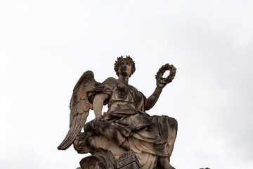statue of the angel with a cross