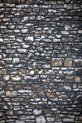 Very old gray natural limestone with dark color as a background for graphical designs