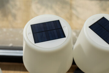 Solar panel lamps recharging in the sun, battery powered solar LED lamps indoor, rechargeable...