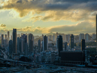 Naklejka na ściany i meble sunset over the Kai Tak kowloon city Hong Kong