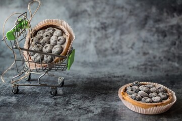 Blueberry goat cake with blue berries in  shopping cart