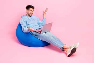 Photo of positive successful worker influencer blogger use modern macbook speaking followers empty space isolated on pink color background