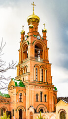 Christian church cross in high steeple tower for prayer