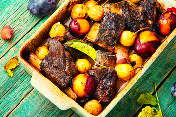 Baked lamb ribs with fruit sauce