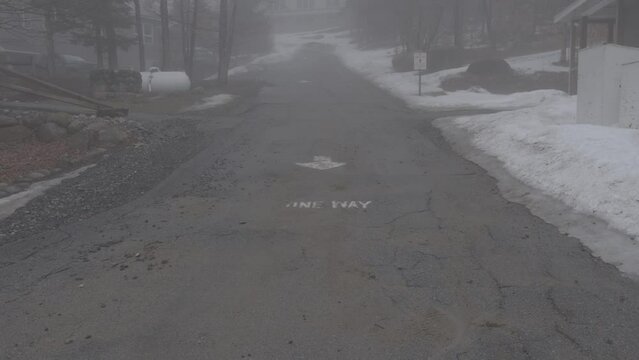 Long foggy street during winter time.