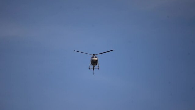 helicopter hovering over news scene