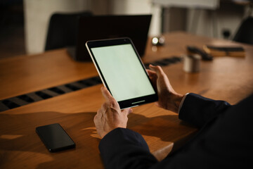 Close up of man using digital tablet