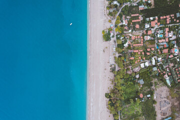 sea with beach and city