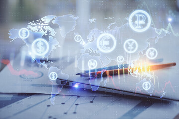 Forex graph hologram on table with computer background. Double exposure. Concept of financial markets.