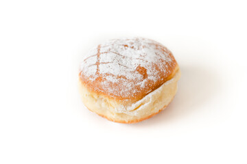 Single isolated Krapfen or Berliner doughnut dusted with icing sugar, traditional German fried Brioche dough pastry filled with vanilla pudding for New Year's or carnival party on white background - 556941520