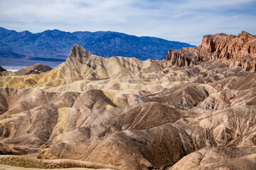 Zabriskie Point. It is a part of the Amargosa Range located east of Death Valley in Death Valley National Park in California, United States, noted for its erosional landscape. USA