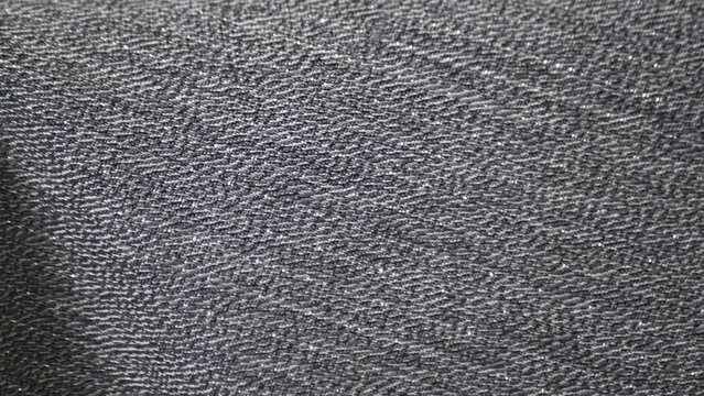 Close up detailed cloth texture of shiny spandex lycra cloth flowing with dolly shot in macro close-up view
