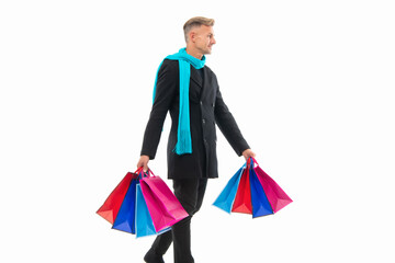 shopping man smile with purchase on background. photo of shopping man with purchase.