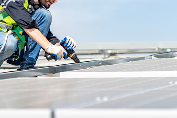 Male engineer installing or checking the working condition of solar panels on the roof or at the height of the factory for saving electricity was broken to use renewable energy from the sun