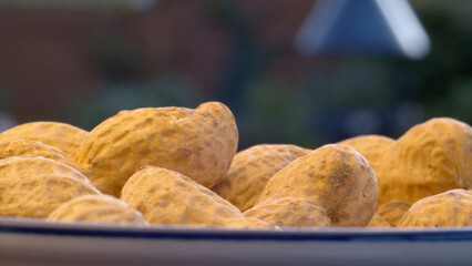 Bowl of peanuts outdoors