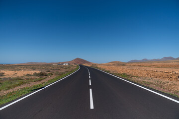 Fototapeta na wymiar road in the desert of Islas Canarias - Fuerteventra island