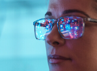 Scientist in glasses looking at screen