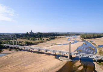 Fotobehang France, Charente-Maritime, Extreme drought revealing river bottom of Loire river © Image Source