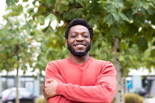Portrait of handsome young man with arms crossed