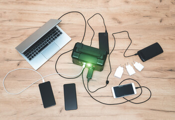 lithium Portable Power Station is charging laptop smartphones.Power banks and other...